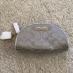 Silver coach cosmetic bag